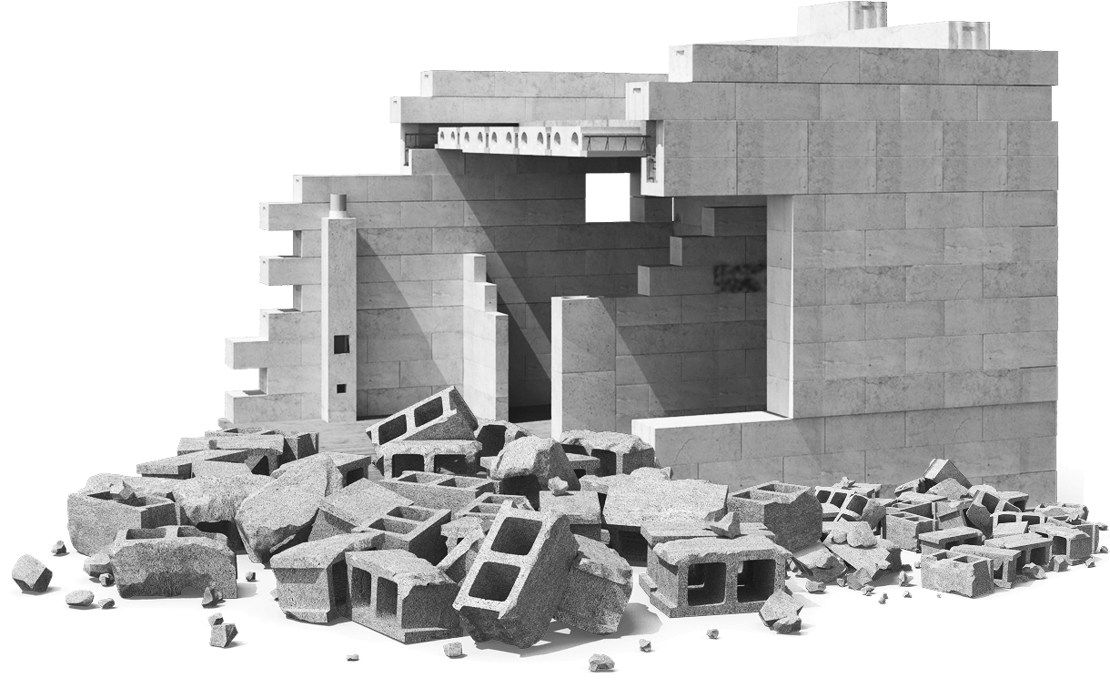 Partially demolished concrete block building with debris